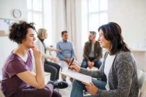 women in group therapy learn about NuLife Behavioral Health